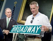 New York Mayor Michael Bloomberg, left, presents new New York Jets quarterback Brett Favre with a Broadway street sign at a news conference. The media event was Friday at New York's City Hall.