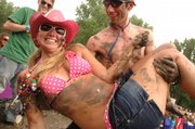 Revelers enjoy the Country Stampede, a music and camping festival that takes place at Tuttle Creek State Park near Manhattan. Brett Mosiman, organizer of the Wakarusa Music and Camping Festival, doesn't like differences in the attendance caps between the two events, a significantly higher law enforcement bill for Wakarusa, and inequities in rent rates between the two events.