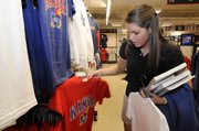 Kansas University sophomore Amanda Garley, of Whitefish Bay, Wis., shops for Jayhawk merchandise on Wednesday at the KU Bookstore in the Kansas Union.