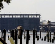 Pilings that supported buildings destroyed during Hurricane Katrina remain in Lake Pontchartrain Thursday along with drainage pumps on the 17th Street canal in New Orleans. The pumps were installed after Hurricane Katrina. The Army Corps of Engineers has spent billions of dollars to improve the levee system, but because of two quiet hurricane seasons, the flood walls have never been tested.