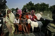 Flood victims are rescued Monday from their marooned villages near Madhepura, 12.5 miles northeast of Patna, India. Indian authorities rushed doctors and medical equipment to flood-devastated northern India on Monday to ward off disease outbreaks.