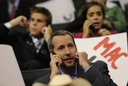 People talk on their cell phones during the Republican National Convention in St. Paul, Minn. While cell phone use is commonplace in the United States, it is even more common in many other parts of the world that don't have an extensive land-line telephone infrastructure.