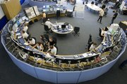 Workers prepare the Large Hadron Collider for its first experiments in Prevessin, France, at the Swiss border near Geneva.
