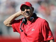 Kansas City Chiefs coach Herm Edwards walks on the sideline in the fourth quarter Sunday in Foxborough, Mass. Even though Damon Huard will start at quarterback Sunday, Edwards has said Tyler Thigpen also will see time.