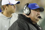 Kansas head coach Mark Mangino glances up at the scoreboard during the third quarter Friday, Sept. 12, 2008 at Raymond James Stadium in Tampa.