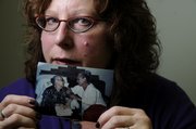 Marcia Epstein lost her mother, Abba Howell, to suicide five years ago. Epstein, the executive director of Headquarters Counseling Center, 211 E. Eighth St., displayed a photo of her mother, at right, on Thursday.