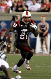 Louisville running back Victor Anderson (20) runs for a 29-yard touchdown against Kansas State. Anderson had 176 yards in the Cardinals' 38-29 victory Wednesday in Louisville, Ky.