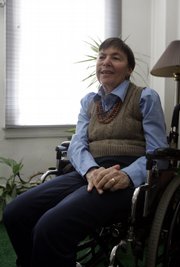 Kathy Leeds poses for a portrait Friday at her apartment on the Upper West Side of Manhattan in New York. Leeds is one of about 500 people enrolled in a telephone-based educational program for homebound seniors called University Without Walls, believed to be the largest program of its kind.