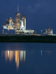Space shuttle Atlantis on pad 39A, left, and space shuttle Endeavour on pad 39B stand ready at Kennedy Space Center in Cape Canaveral, Fla. Atlantis is targeted for an Oct. 10 launch on a mission to service the Hubble Space Telescope. Endeavour will be on standby in the unlikely event that a rescue mission for the Atlantis's crew would be necessary. After Endeavour is cleared from its duty as a rescue vehicle, workers will move it to pad 39A in preparation for a mission to the International Space Station on Nov. 12.