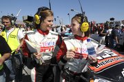 Pit-road reporters Jamie Little, left, and Shannon Spake take a break on the scene in Daytona Beach, Fla. The women are in Kansas City, Kan., for this weekend's NASCAR races at Kansas Speedway.