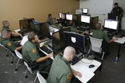 U.S. Border Patrol interns work at computer terminals during a training class this month at the Border Patrol sector headquarters in Imperial, Calif. Towns and small cities along the 1,952-mile border with Mexico have benefited economically from the Border Patrol's growth over the last decade.