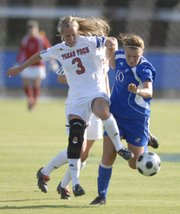 Kansas' Monica Dolinsky (10) battles Texas Tech's Shannon Sims for the ball Friday at the Jayhawk Soccer Complex. KU won, 2-0.