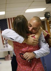 Tammy Ziesenis, left, welcomes her son, Sid Pastor III, home from his third tour of duty in Iraq on Saturday, Oct. 4, 2008 during a celebration at the VFW in Lawrence.