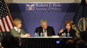 U.S. rep. Nancy Boyda, D-Kan., left, and State Treasurer Lynn Jenkins went head to head before a full house Monday at the Dole Institute of Politics. KU law professor Mike Kautsch moderated the debate.