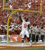 Texas cornerback Chykie Brown (8) celebrates the Longhorns' 45-35 win over No. 1 Oklahoma in an NCAA college football game, Saturday, Oct. 11, 2008, in Dallas.