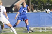 Kansas University's Shannon Mccabe connects on a lengthy side shot on goal in the first half. The Jayhawks beat Texas A&M, 1-0, on Friday at Jayhawk Soccer Complex. The victory over No. 6 Texas A&M was the highest-ranked opponent a KU team ever has defeated.