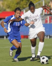 Lauren Jackson, left, battles for position to the ball against a Texas A&M player in the Jayhawks' game at the Jayhawk Soccer Complex Friday, Oct. 17, 2008.