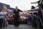 Republican presidential candidate Sen. John McCain, R-Ariz., greets supporters as he arrives at a rally at Heartland High School and Academy in Belton, Mo. McCain made a swing across the battleground state of Missouri on Monday.