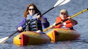 Dot Nary and her husband, Norm White, paddle the slient waters of Lone Star Lake. Nary is a Kansas University researcher and advocate on disability issues.