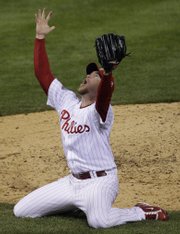 Philadelphia Phillies pitcher Brad Lidge reacts after the final out in Game 5 of the World Series. The Phillies defeated the Tampa Bay Rays, 4-3, to win the series Wednesday in Philadelphia. Story, page 5B