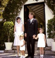 This April 14, 1963, file photo shows President John F. Kennedy and family outside the Palm Beach, Fla., home of the president's father after a private Easter Service. From left are first lady Jacqueline Kennedy, John Jr., 3, President Kennedy, and Caroline, 5.