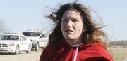 Barbara Jo Schnegelsiepen, 27, of Topeka, was taken into custody Tuesday afternoon after a high-speed chase Tuesday afternoon. Lawrence police, Douglas County Sheriff's deputies and other law enforcement agencies chased the vehicle whose driver was connected to a break-in that happened in Lawrence earlier Tuesday. The chase lasted for 45 minutes and covered much of northwest Douglas County. A Lawrence police officer was struck by the fleeing vehicle shortly before this photo was taken. Another officer stopped the chase a few minutes later by striking the fleeing vehicle with his vehicle.