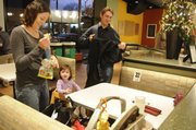 Kendra Kuhlman, along with her husband, Quinn, often take their children Les, 6 months old, and Keirn 20 months old, out to eat. Kendra has leaned to pack a few extra items to keep her children entertained.
