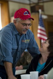 John Rodecap Jr. laughs with his wife, Cindy, during his welcome-home dinner Saturday at Buck Creek School, near U.S. Highway 24 in Jefferson County. John, one of several family members to serve in Iraq, returned from duty last week.