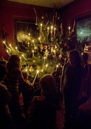JSerina Hearn and Tony Backus open up their home on Massachusetts Street to friends and family each year to celebrate the holidays. Many of the party attendees are friends of the couple’s five children.