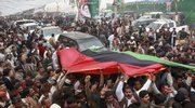 Supporters of Pakistan's slain former Prime Minister Benazir Bhutto chant slogans as they arrive at her mausoleum to pay homage, Saturday, Dec. 27, 2008 in Garhi Khuda Bakhsh near Larkana, Pakistan. Up to 200,000 Pakistanis gathered at the mausoleum of Bhutto on the first anniversary of her assassination, some of them walking hundreds of miles (kilometers) to get there.