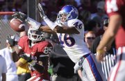 Kansas cornerback Justin Thornton (46) breaks up a pass intended for Oklahoma receiver Ryan Broyles in this file photo from Oct. 18. Thornton started the season at safety but moved to corner, a move that has helped improve the Jayhawks’ pass defense.
