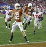 Texas quarterback Colt McCoy celebrates as he scores against Ohio State during the third quarter of the Fiesta Bowl on Monday in Glendale, Ariz.