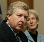 Dan Biles answers questions about his appointment to the Kansas Supreme Court by Gov. Kathleen Sebelius, right, during a news conference in her office in Topeka on Wednesday.