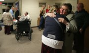 Judy Fowler, right, accepts a hug from a congregation member of the Williamstown Assembly of God, where a prayer vigil service was held Sunday night for Fowler's son, Shawn Fowler. Shawn Fowler, 44, has been missing since Dec. 10, 2008.