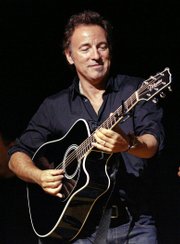 In this Nov. 5, 2008 file photo, Bruce Springsteen plays his guitar up for auction at the 2nd annual Stand Up For Heroes: A Benefit for the Bob Woodruff Foundation in New York.