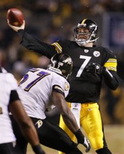 Pittsburgh Steelers quarterback Ben Roethlisberger throws a pass over Baltimore Ravens' Bart Scott (57) during the first quarter of the NFL AFC championship football game in Pittsburgh, Sunday, Jan. 18, 2009.
