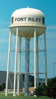 A Fort Riley water tower advertising The Big Red One military unit sits off of Highway 70 upon approaching the town of Junction City. With the return of the unit to Fort Riley, the town is experiencing a population boom as well as an influx of developers and contractors.