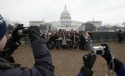 A group of students from Bellarmine Jefferson High School from Burbank, Calif., pose for pictures in front of the Capitol in Washington, Monday, Jan. 19, 2009, where the swearing in for President-elect Barack Obama will take place on Tuesday.