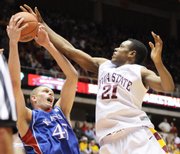 Iowa State’s Craig Brackins (21) fights for a rebound with Kansas University’s Cole Aldrich in this Jan. 24, 2009, file photo in Ames, Iowa.