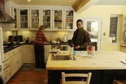 James and Ann Cooper live on 2 acres in the heart of the city, in an old sandstone farmhouse with a fireplace that casts heat throughout the house.