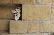 Two-foot walls of sandstone make up the home of James and Ann Cooper, who live on 2 acres of land in the heart of the city.