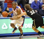 KU's Danielle McCray tries to make a move on Colorado's Kelly Jo Mullaney during the Jayhawks' matchup with CU on Feb. 4, 2009.