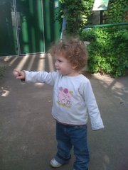 This undated handout photo provided by the journal Science shows a gesturing child. Pointing, waving bye-bye and other natural gestures seem to boost toddlers’ budding vocabulary.