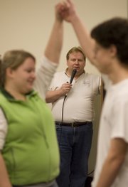 Kevin Oneslager, Lawrence, calls the steps during a Lone Star Square Dance Club practice Wednesday, Feb. 4, 2009, at the Dreher Building of the Douglas County Fairgrounds.