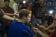 Senior KU quarterback Todd Reesing talks to the media Friday during a spring football news conference.