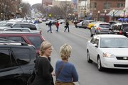 Shoppers browse along Massachusetts Street. Downtown Lawrence is widely considered a gem of the city.