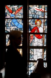 A parishioner attends Sunday service Feb. 8 at St. Frances Cabrini Catholic Church in Scituate, Mass. She and others are involved in a string of sit-ins going on round-the-clock for more than four years at five Roman Catholic churches closed by the Boston Archdiocese.