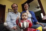 Brett Stoppel and Holly Krebs, of Lawrence, planned financially for the arrival of their daughter, Evy, researching what baby items they’d actually need and prioritizing their spending.