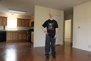 New homeowner Joshua McGee has benefitted from the HUD-financed Tenants to Homeowners program, which is funded based on census results. He was pictured in March.