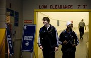 Kansas guards Conner Teahan and Sherron Collins have a laugh as they leave the Metrodome following a day of interviews and practice Saturday March 21, 2009.
